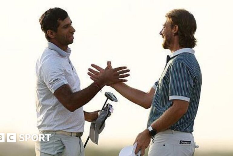 Aaron Rai shaking hands with Tommy Fleetwood after his winning putt.