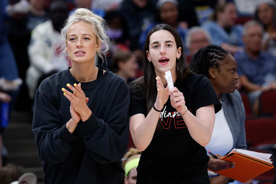 Indiana Fever guards Sophie Cunningham and Caitlin Clark react from the bench during a WNBA game against the Chicago Skyr.Kamil Krzaczynski-Imagn Images