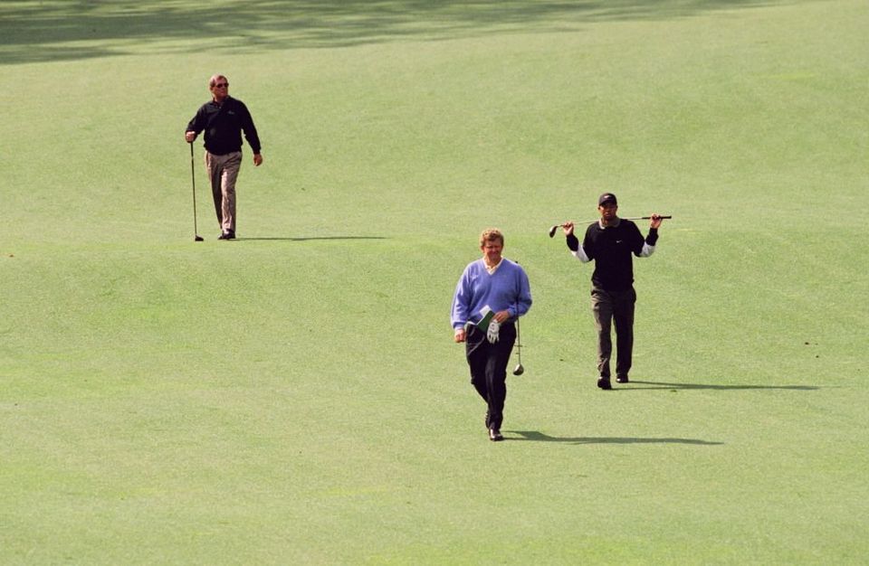 Fuzzy Zoeller, Colin Montgomerie, and Tiger Woods walk down the fairway during the 1998 Masters Tournament at Augusta National Golf Club. (Photo by Augusta National/Getty Images)