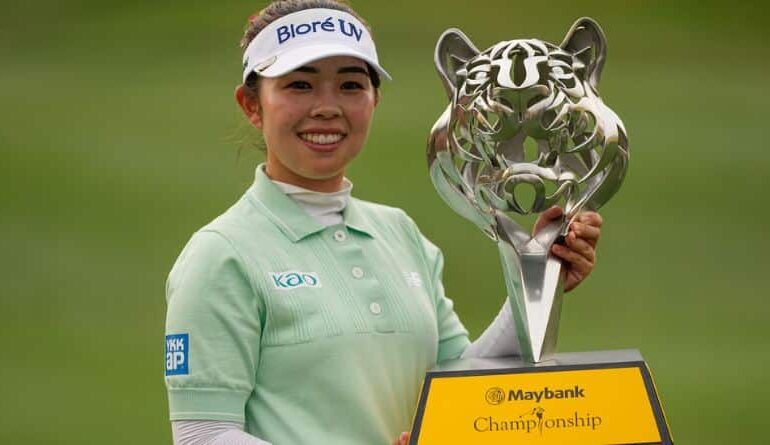 Miyu Yamashita of Japan holds the winning trophy after winning the LPGA Tour's Maybank Championship at Kuala Lumpur Golf and Country club in Kuala Lumpur, Malaysia, Sunday, Nov. 2, 2025. (AP Photo/Kien Huo)