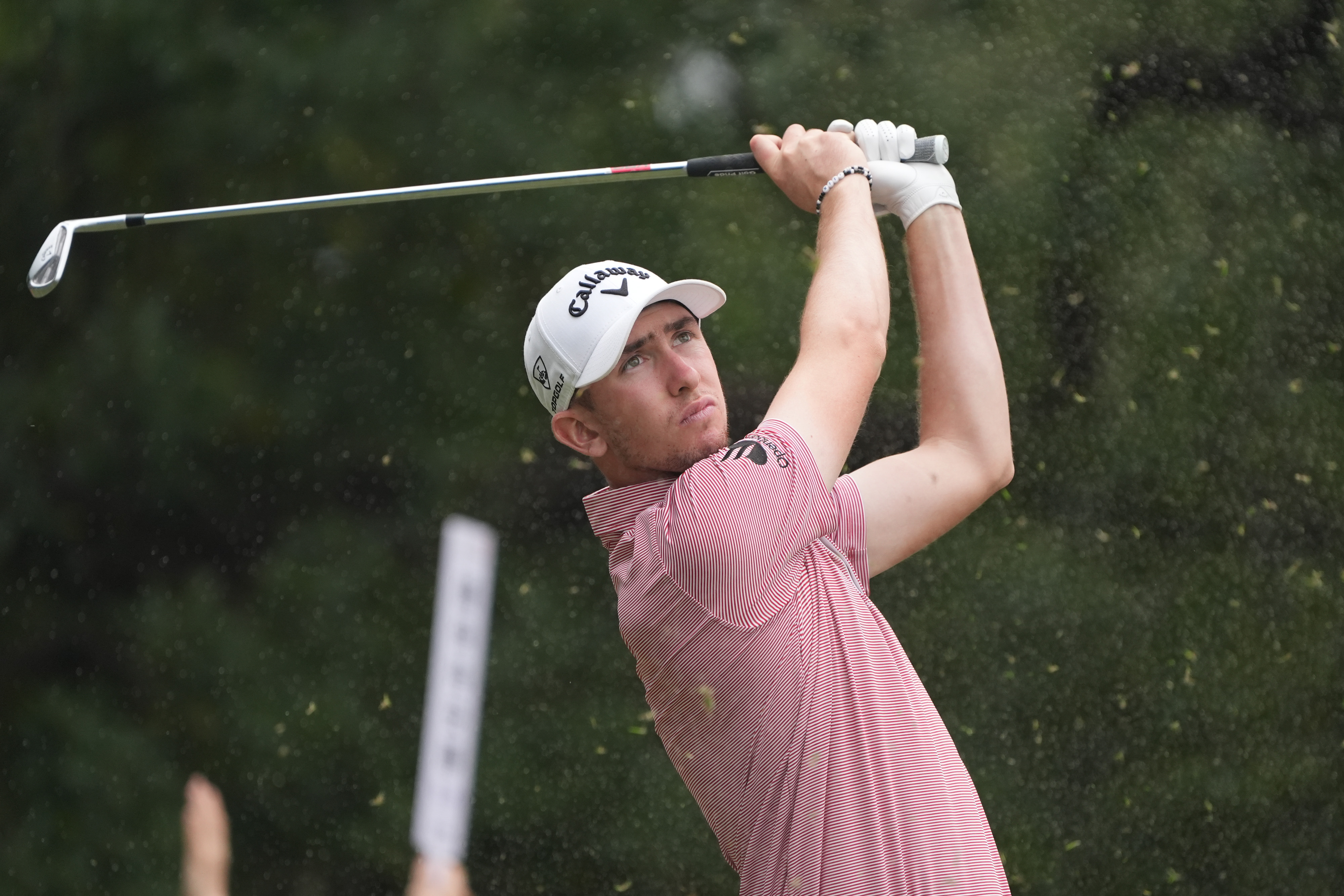 Tom McKibbin hits an iron shot