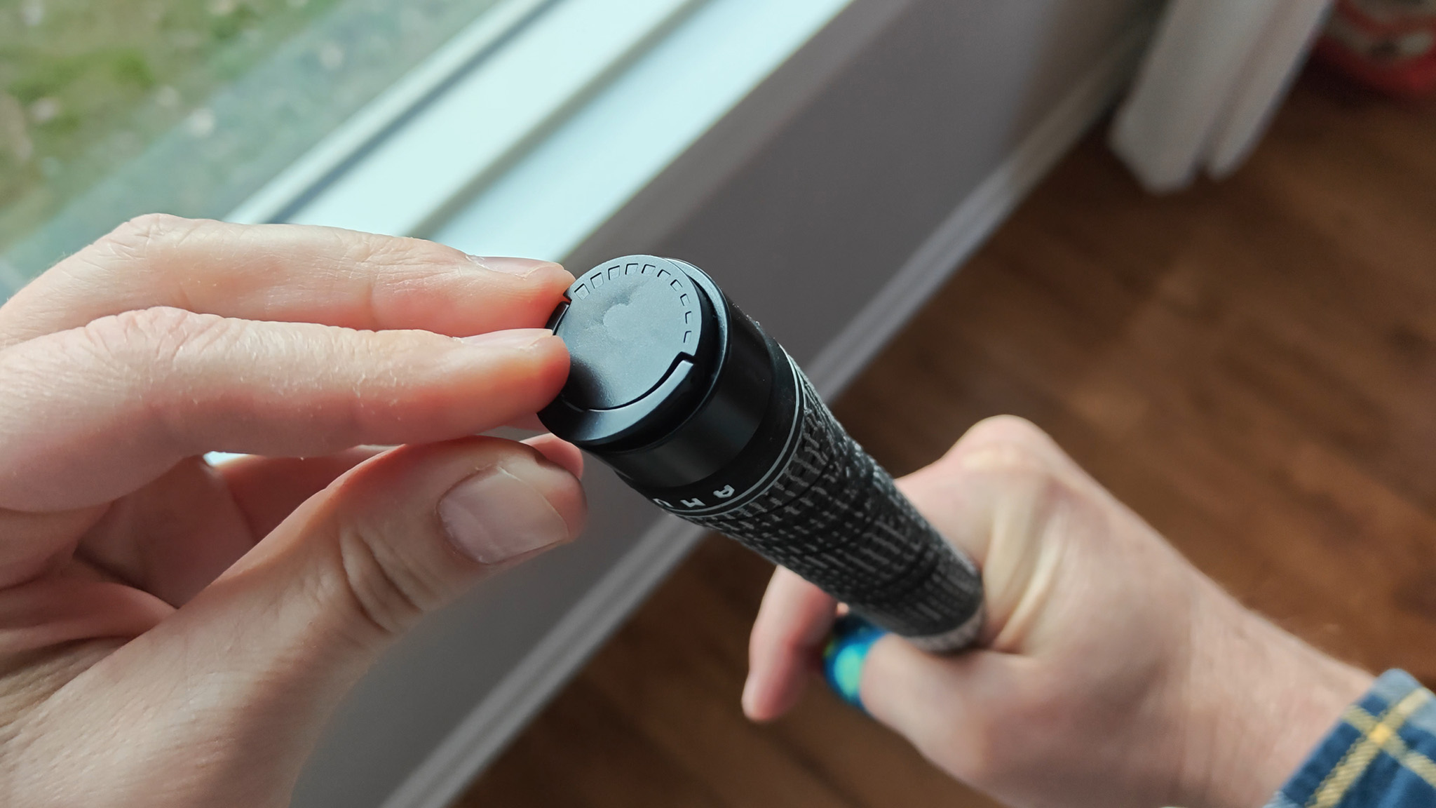 How to adjust the force needed to activate the mechanism in the AMVR haptic golf club accessory for Meta Quest 3 and 3S