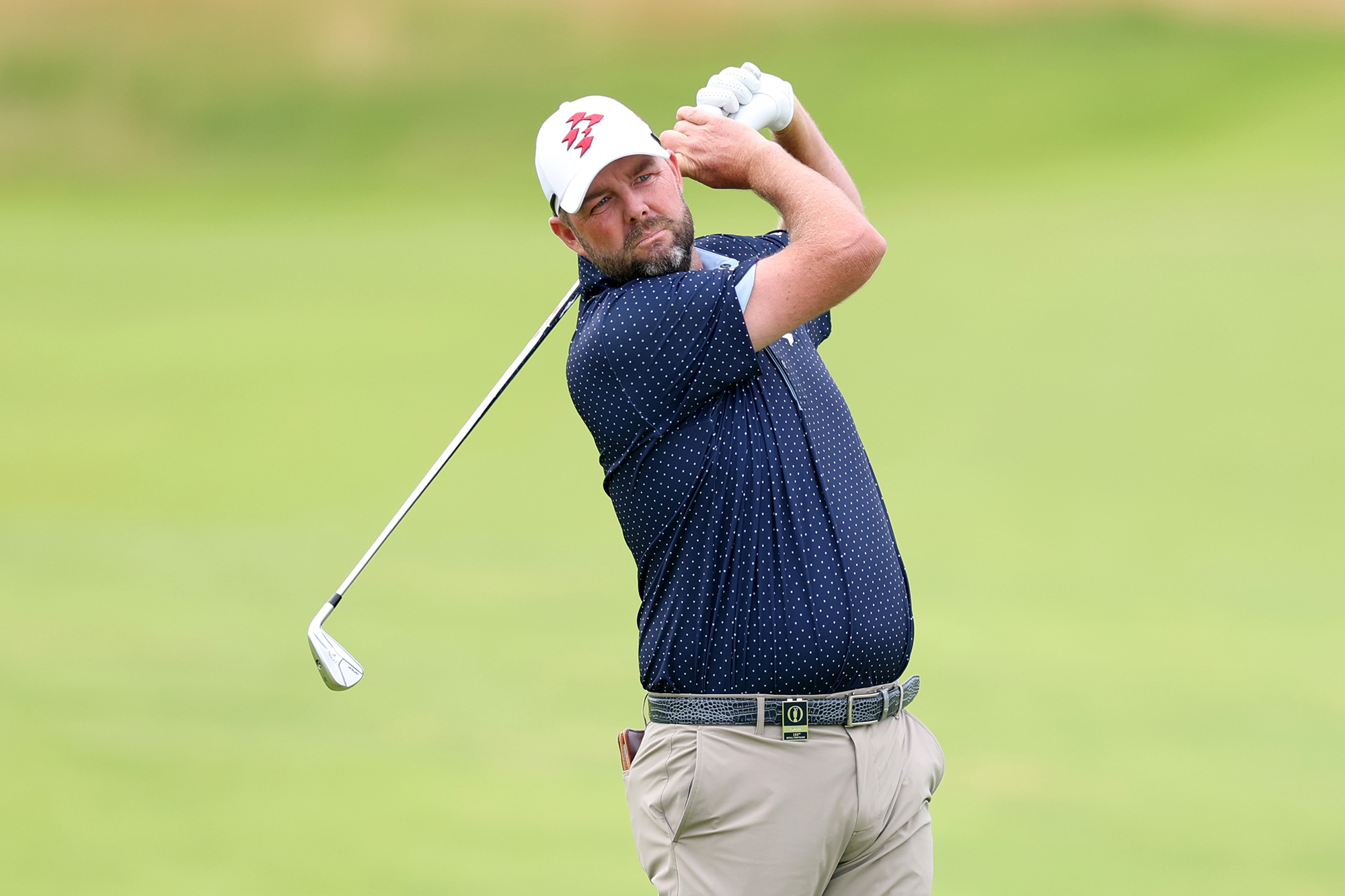 Marc Leishman in the finish position with an iron
