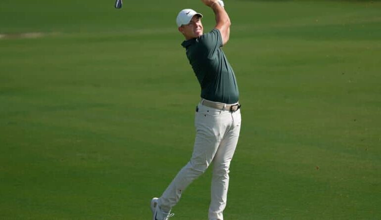 Rory McIlroy of Northern Ireland plays his second shot on the 1st hole during the first round of World Tour Golf Championship at Jumeirah Golf Estates, in Dubai, United Arab Emirates, Thursday, Nov. 13, 2025. (AP Photo/Altaf Qadri)