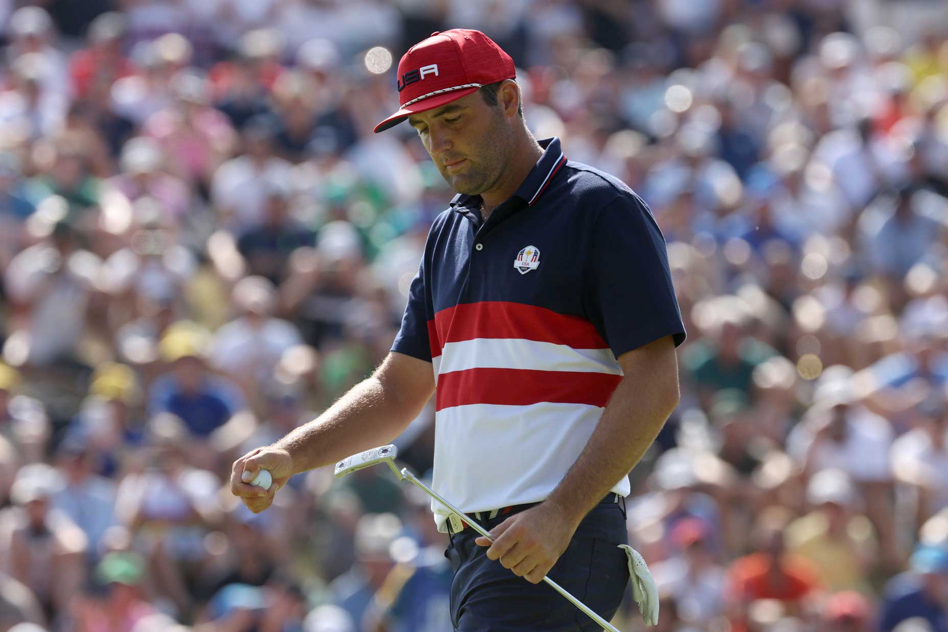 Scottie Scheffler of Team United States reacts on the fourth green during the Sunday singles matches of the 2023 Ryder Cup at Marco Simone Golf Club on October 01, 2023 in Rome, Italy.