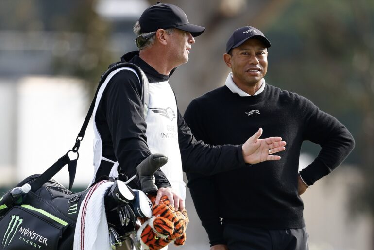 Woods showcases new caddie