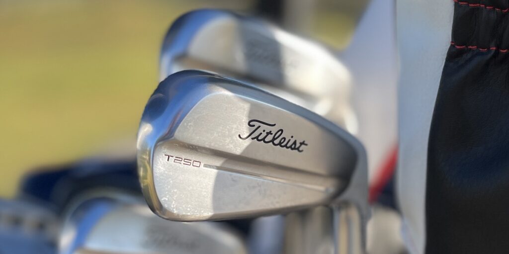 Titleist T250 irons in the bag at the course