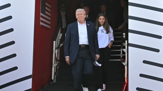 U.S. President Donald Trump and his granddaughter Kai Trump attend the 45th Ryder Cup golf competition at Bethpage Black Golf Course in Farmingdale, New York.(via REUTERS)