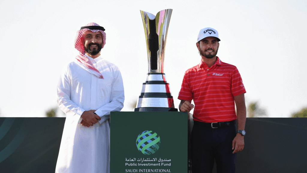 Saudi International Prize Money Payout 2025 Noah Alireza (left) and Abraham Ancer stand either side of the PIF Saudi International trophy in 2024