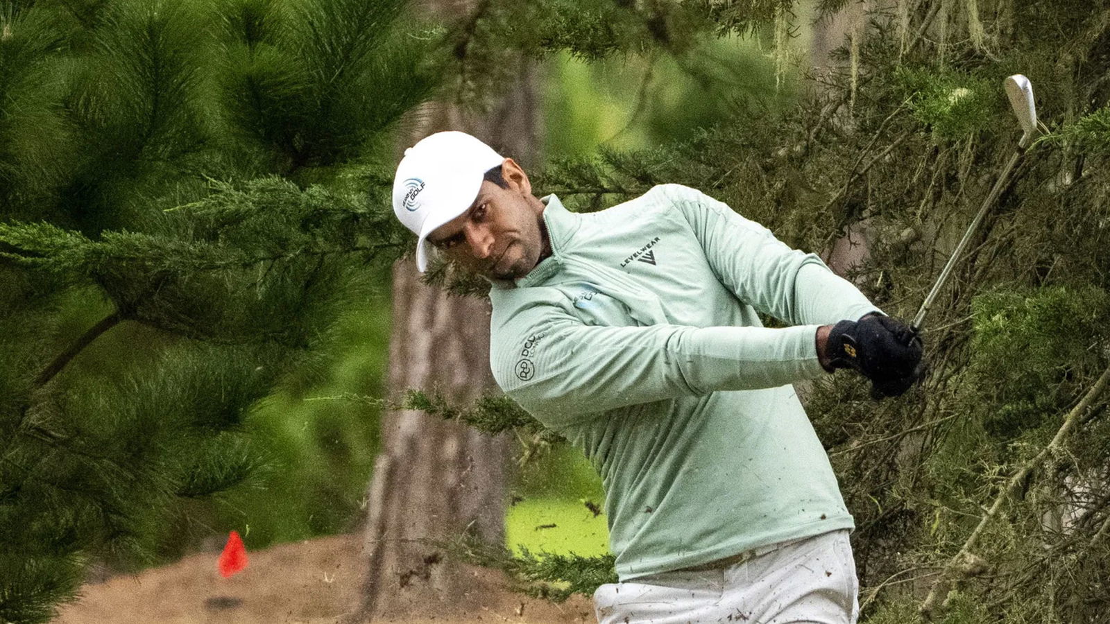 Aaron Rai plays a shot with his TaylorMade P7TW irons