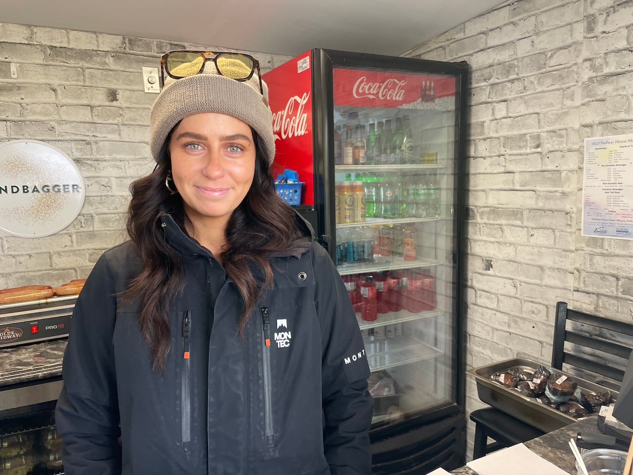 A smiling woman in a golf course canteen