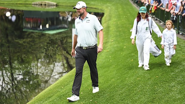 AUGUSTA, GA - APRIL 06: Marc Leishman of Australia and his wife Audrey Leishman smile with their daughter during the Par Three Contest prior to the Masters at Augusta National Golf Club on April 6, 2022, in Augusta, Georgia. (Photo by Keyur Khamar/PGA TOUR via Getty Images)