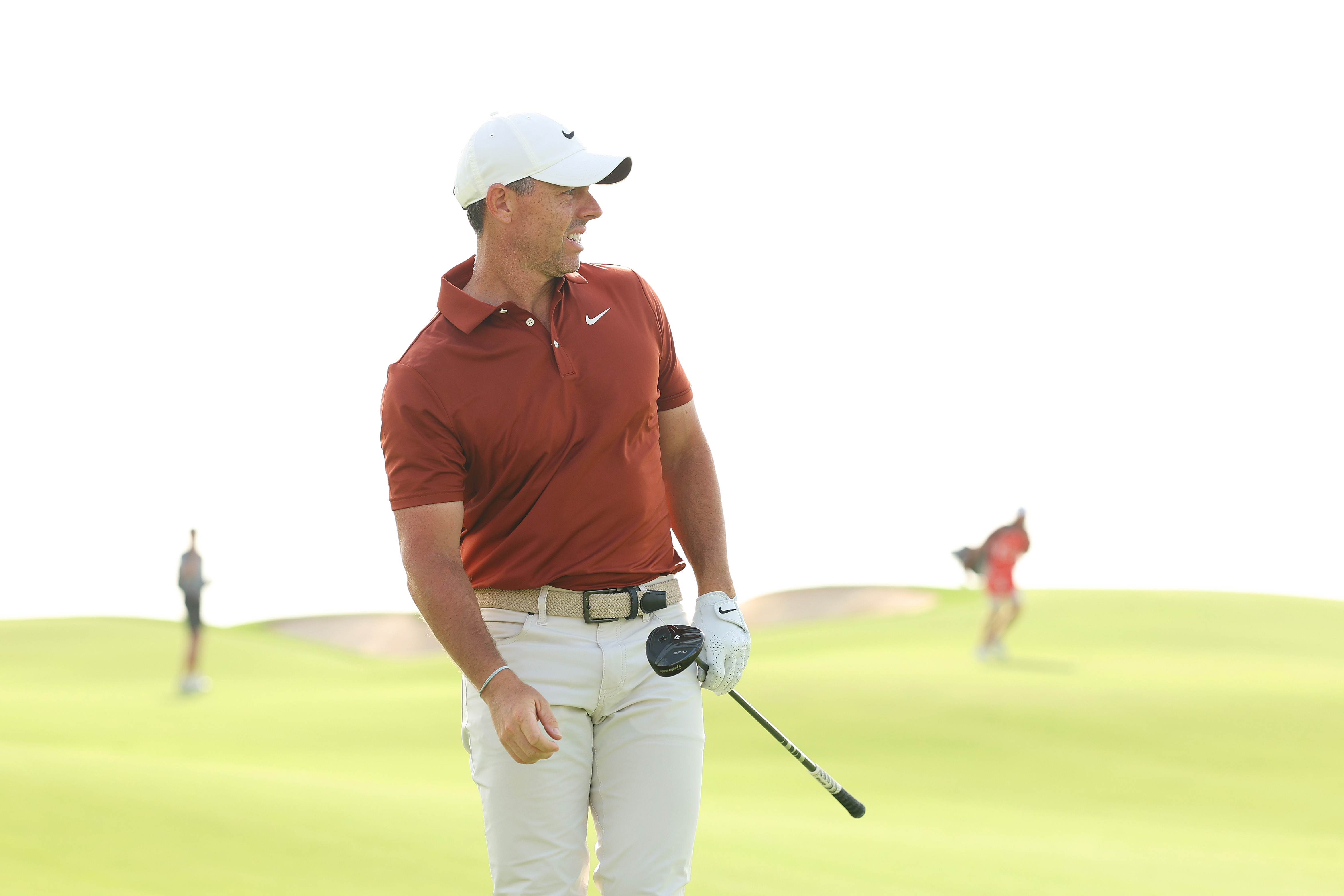 Rory McIlroy watches his approach shot into the green