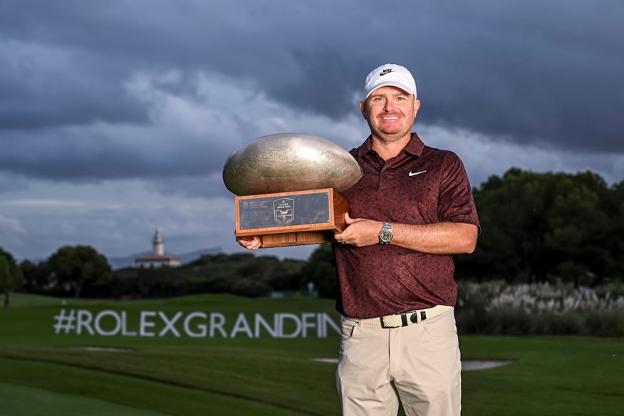 James Morrison shows off the Rolex Grand Final trophy.