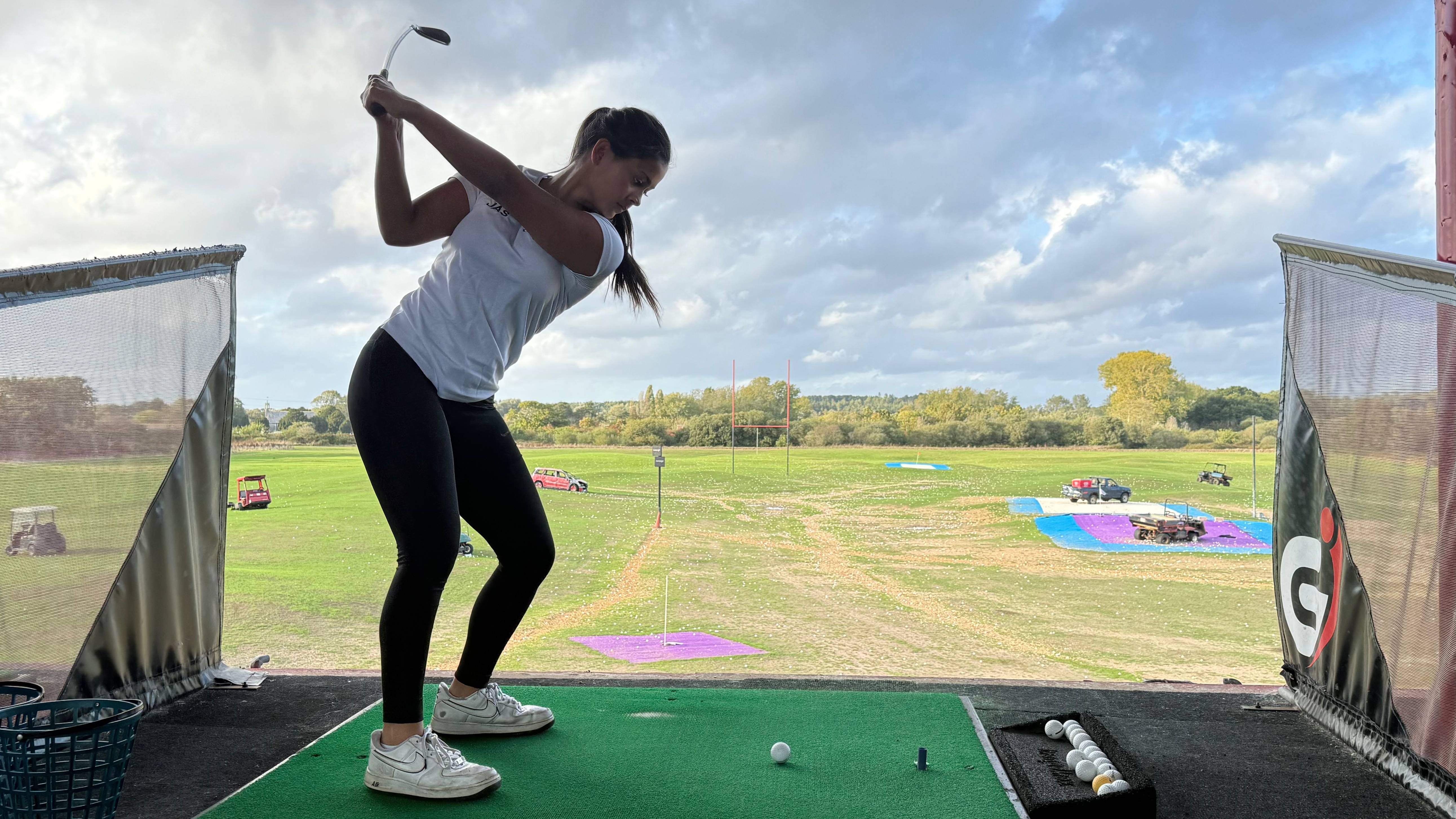 Female golfer at the range