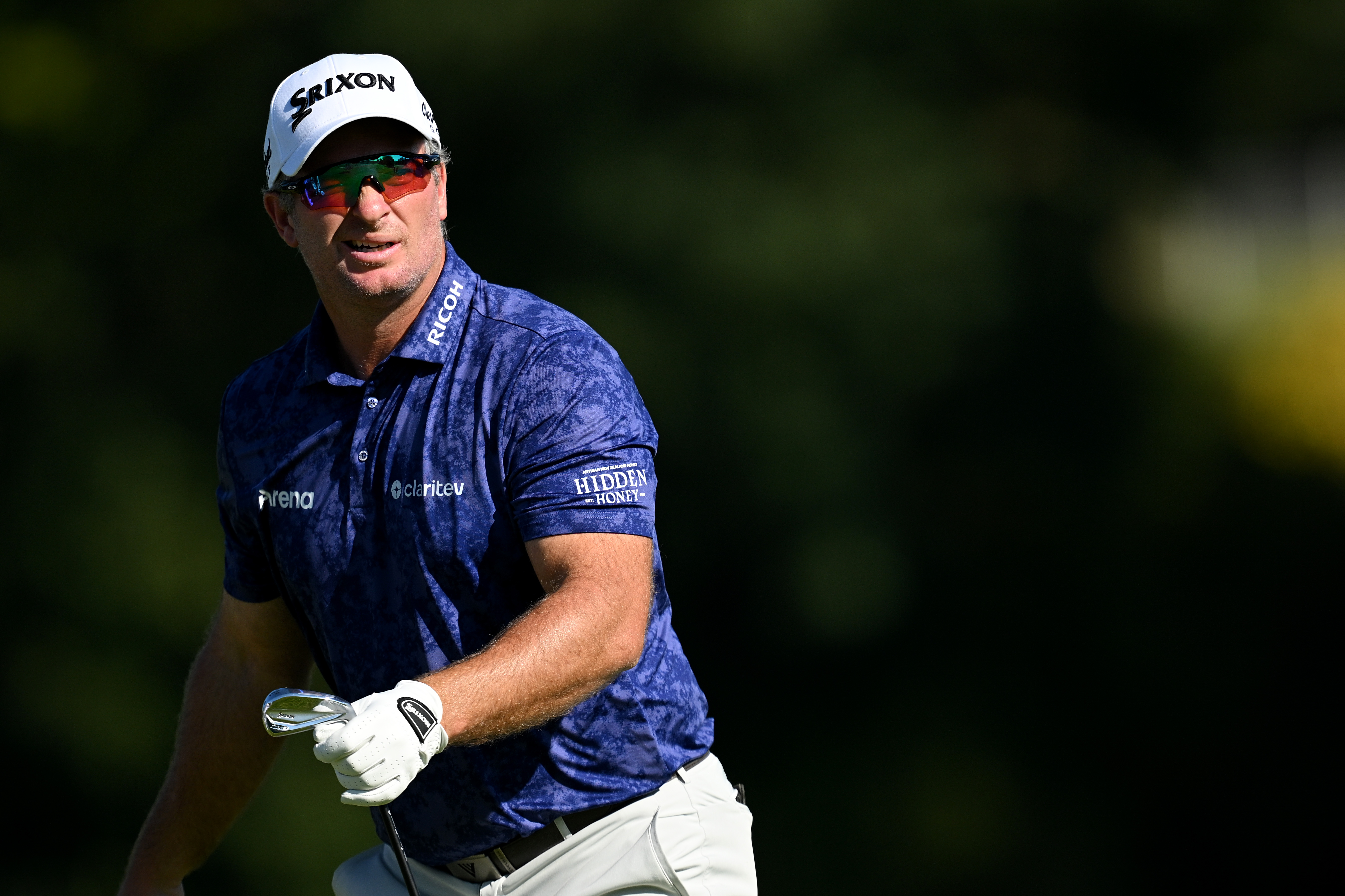 Ryan Fox hits an iron shot and watches its flight