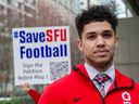 SFU Red Leafs quarterback Keyshaun Dorsey joins teammates and past players of the school's football program as they gather at B.C. Supreme Court in Vancouver on April 13, 2023, to protest the cancellation of the program.