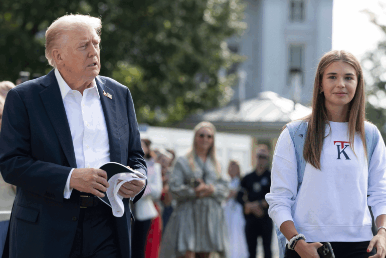 US President Donald Trump (left) walks alongside his granddaughter Kai