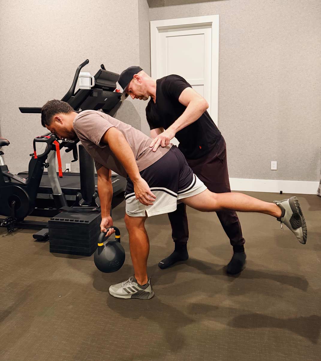david sundberg works in the gym with xander schauffele