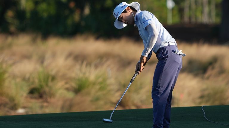 Somi Lee of Korea watches her putt on the 18th green during the first round of the LPGA Tour Championship golf tournament, Thursday, Nov. 20, 2025, in Naples, Fla. (AP Photo/Marta Lavandier)