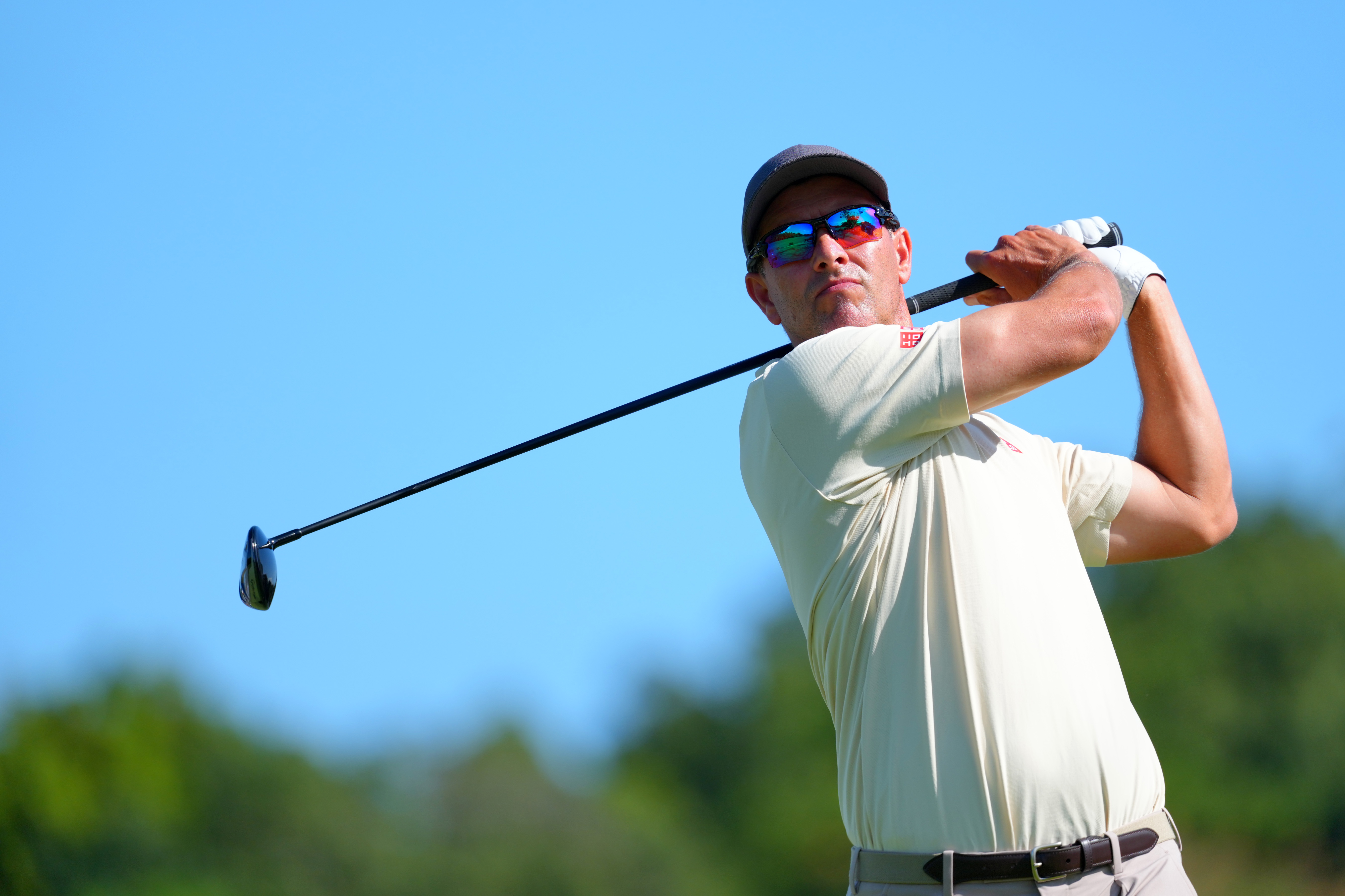 Adam Scott hits a fairway wood