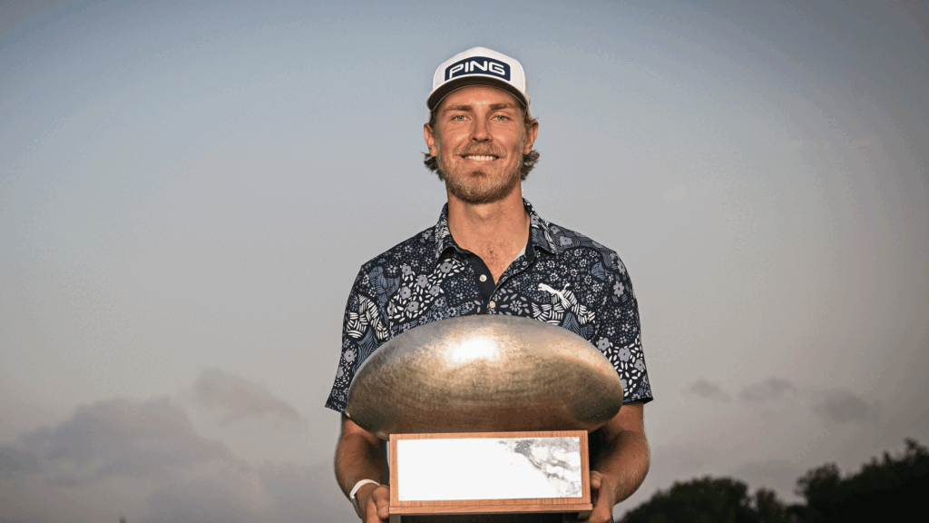 Kristoffer Reitan poses with the Challenge Tour Grand Final trophy after winning in 2024