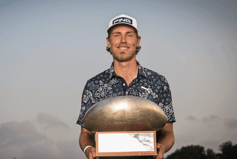 Kristoffer Reitan poses with the Challenge Tour Grand Final trophy after winning in 2024