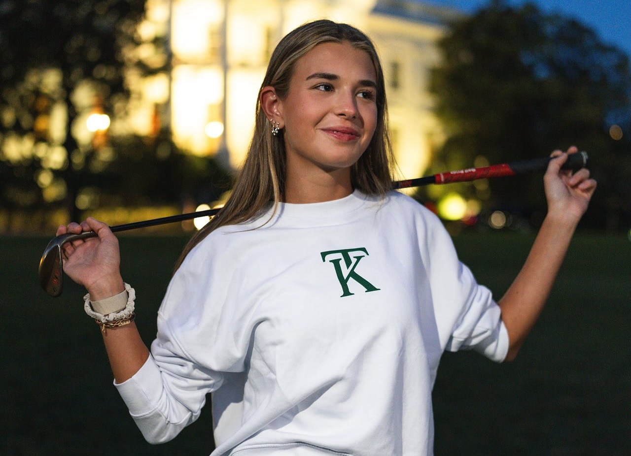 Kai Trump showcasing her merchandise.