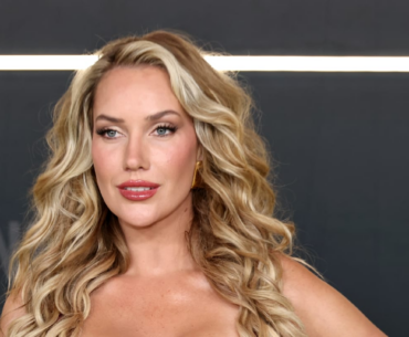 Paige Spiranac Tees Off in a Navy Halter Top and White Mini Skirt