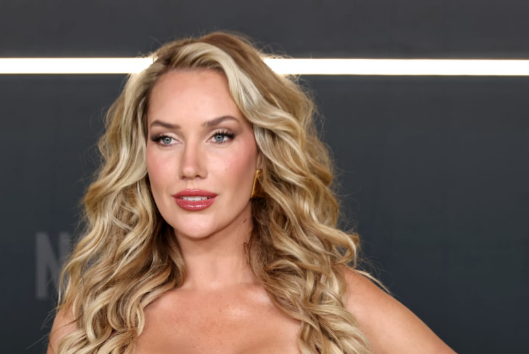 Paige Spiranac Tees Off in a Navy Halter Top and White Mini Skirt