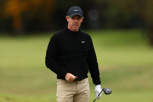 Rory McIlroy stands on the golf course