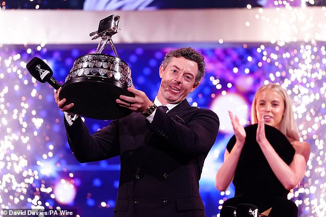 Rory McIlroy lifts the SPOTY gong, presented to him by 2024 winner Keely Hodgkinson