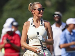 Paige Spiranac reacts to a tee shot during the 2024 Creator Classic in Atlanta, Georgia.
