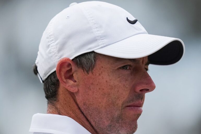 Rory McIlroy's late birdie burst means he'll be playing on the weekend at the Australian Open