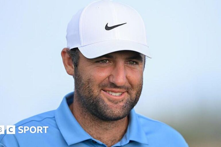 Scottie Scheffler smiles during a round