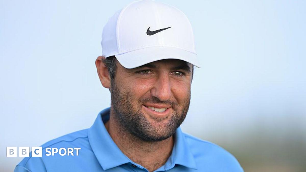 Scottie Scheffler joins Tiger Woods with fourth straight PGA Tour player of year award Scottie Scheffler smiles during a round