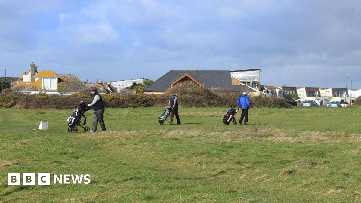 Solent Meads: Council looks to ‘maintain access’ to golf course Three golfers with golf carts walking on the gold course at Solent Meads. In the background are neighbouring houses - large dormer bungalows with pitched roofs and two-storey modern houses with balconies.