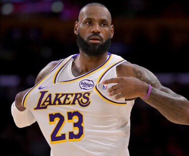 LeBron James draws criticism for 'golf swing' during national anthem
