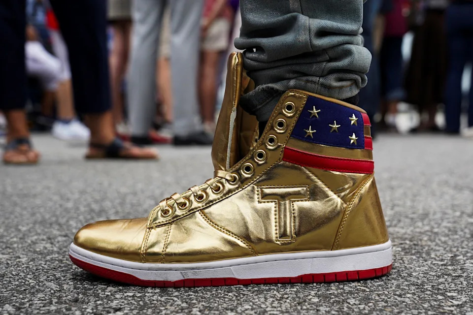 Dom Lucre wears "The Never Surrender High-Tops" sneakers as supporters of Republican presidential candidate and former U.S. President Donald Trump await his arrival for the first 2024 presidential debate with U.S. President Joe Biden, hosted by CNN in Atlanta, at Hartsfield-Jackson Atlanta International Airport, Georgia, U.S., June 27, 2024.