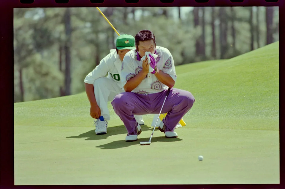 04/14/1995; Augusta, Georgia, USA; Masashi Ozaki and caddie line up putt at the Augusta National Golf Course during the 1995 Masters. Mandatory Credit: File Photo -The Augusta Chronicle via USA TODAY NETWORK© The Augusta Chronicle-USA TODAY NETWORK&period;