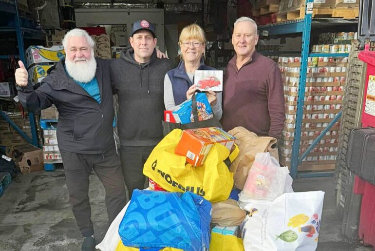 Participants of the Broken Balls golf tournament made a donation of $6,400 and 750 pounds of food to Mary Robson, executive director of the Friends In Need Food Bank. (Facebook/Special to The News)