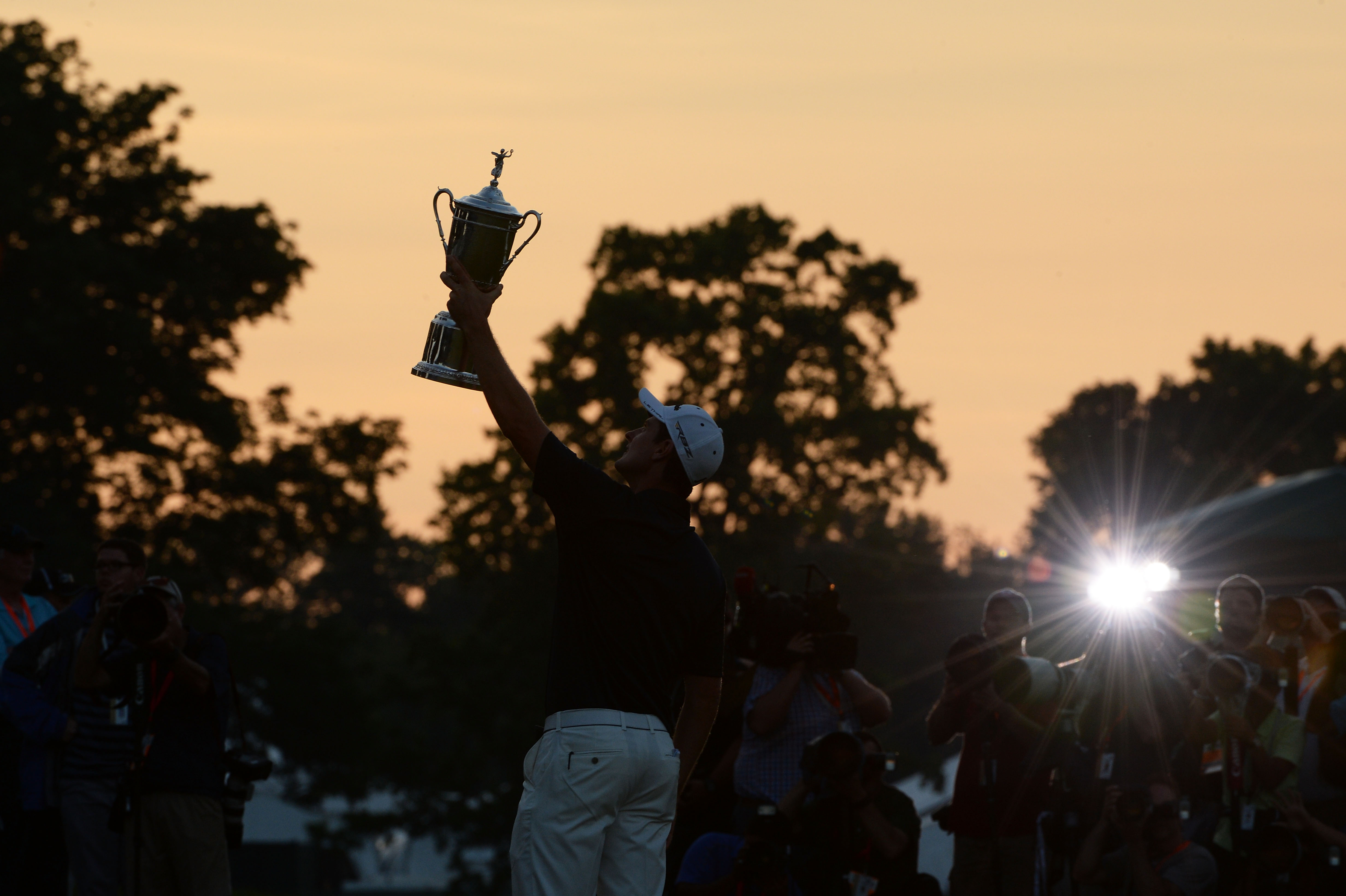 Justin Rose holds the US Open aloft at Merion in 2013