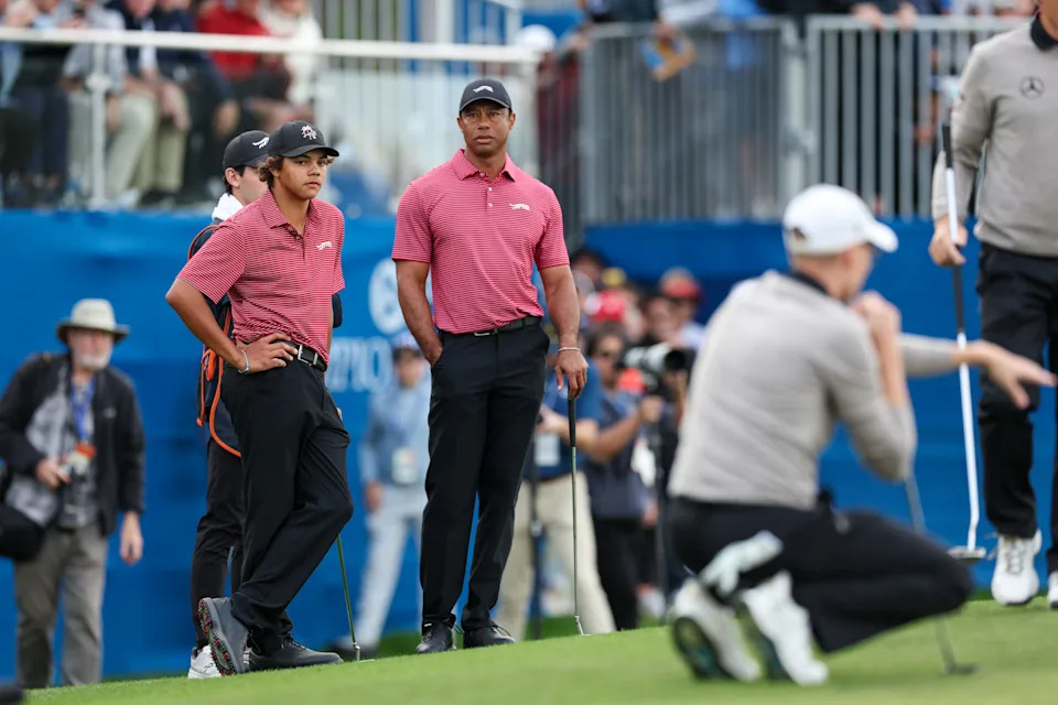 Tiger Woods and son Charlie Woods look on during the 2024 PNC Championship at The Ritz-Carlton Golf Club in Orlando.