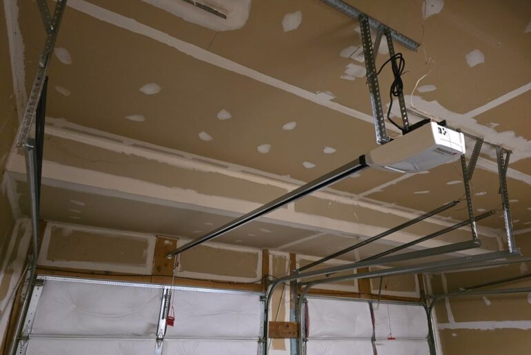 Garage door motor and Track lift possible? How much does it cost (ballpark)?