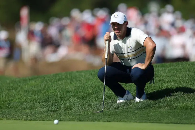 FILE PHOTO: Golf - The 2025 Ryder Cup - Bethpage Black Golf Course, Farmingdale, New York, United States - September 28, 2025 Team Europe's Rory McIlroy lines up his putt on the 11th hole during the singles REUTERS/Paul Childs/File Photo