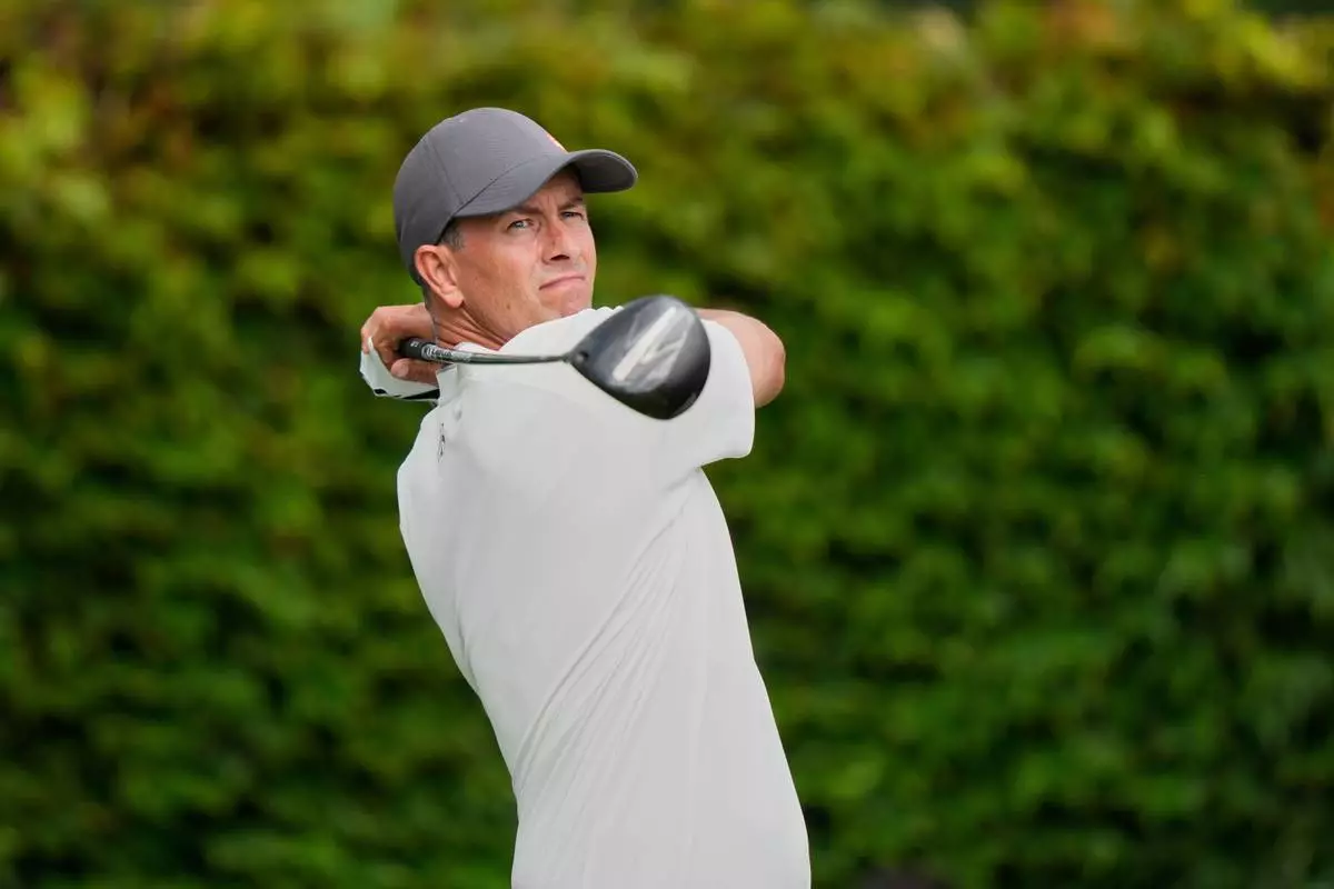FILE - Adam Scott, of Australia, tees off on the ninth hole during the final round of the U.S. Open golf tournament at Oakmont Country Club, June 15, 2025, in Oakmont, Pa. (AP Photo/Charlie Riedel, File)
