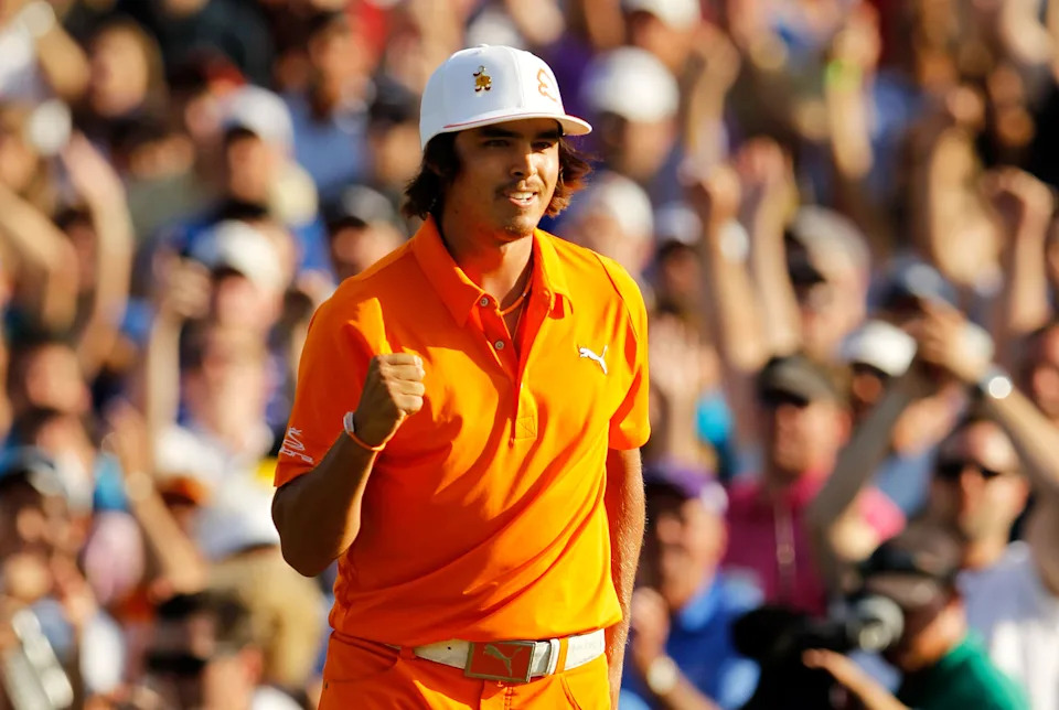 Rickie Fowler of the United States celebrates after making a putt for birdie on the first playoff hole to secure his first PGA Tour victory during the final round of the Wells Fargo Championship at Quail Hollow Club on May 6, 2012 in Charlotte, North Carolina.