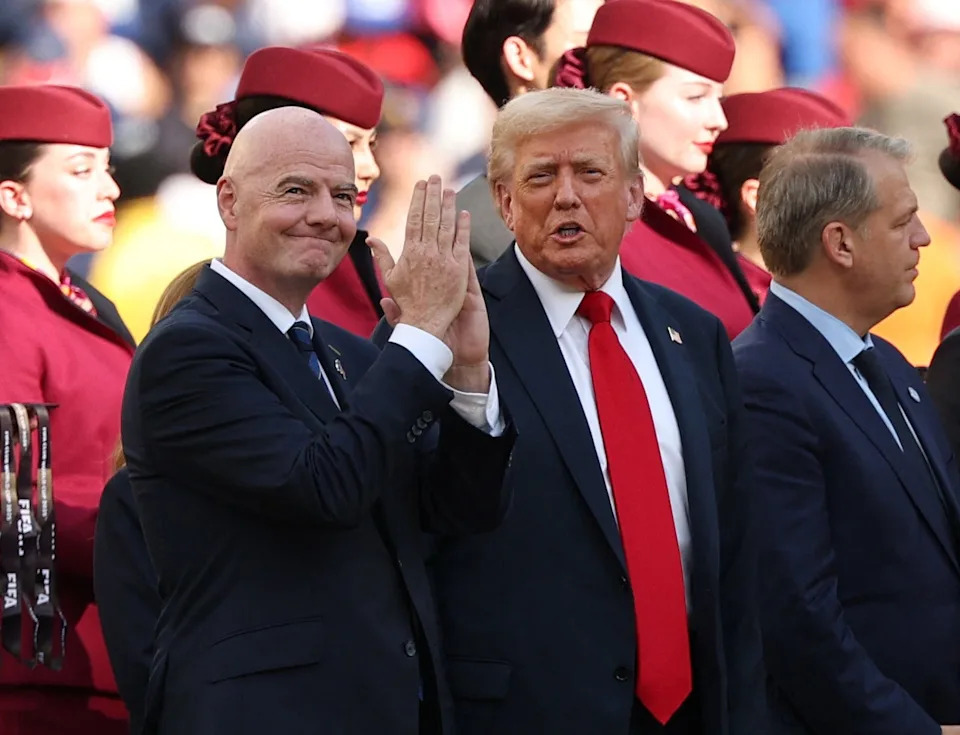 U.S. President Donald Trump, FIFA president Gianni Infantino and Chelsea chairman Todd Boehly on the pitch during the trophy presentation after the final of the 2025 FIFA Club World Cup at MetLife Stadium on July 13, 2025.