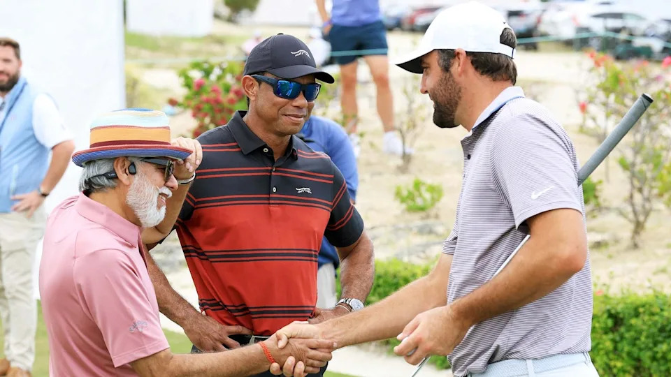 Dr. Pawan Munjal with Tiger Woods and Scottie Scheffler at the Hero World Challenge.