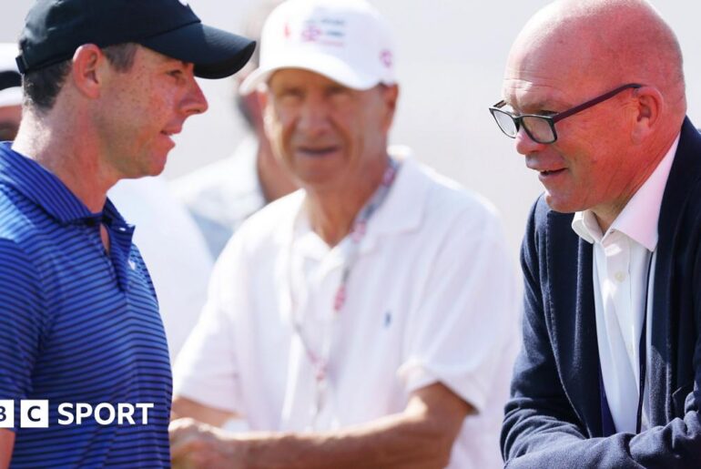 Rory McIlroy chatting to DP World Tour chief executive Guy Kinnings